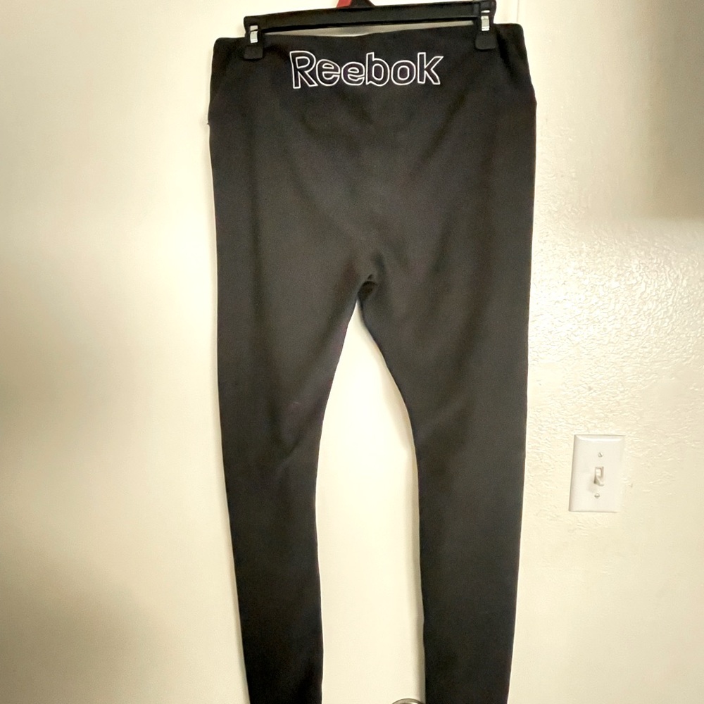 Nice Reebok woman Black Bottoms ,with a little packet on waistband size large .